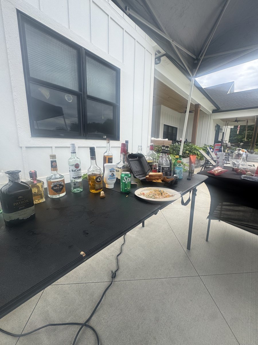 Top-shelf spirits lined up on the mobile bar