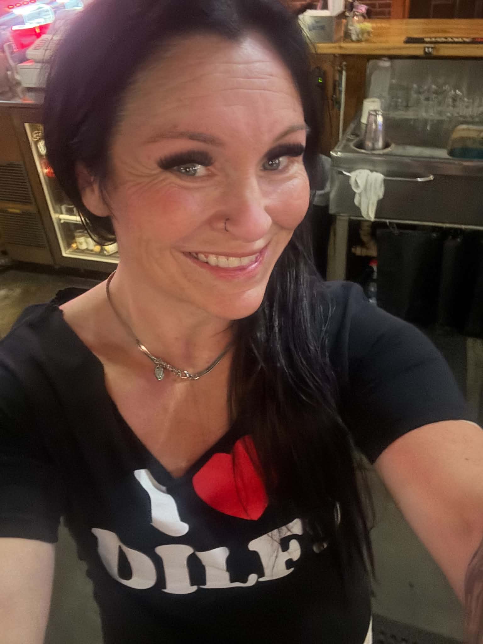 Mandy smiling on her way to an event