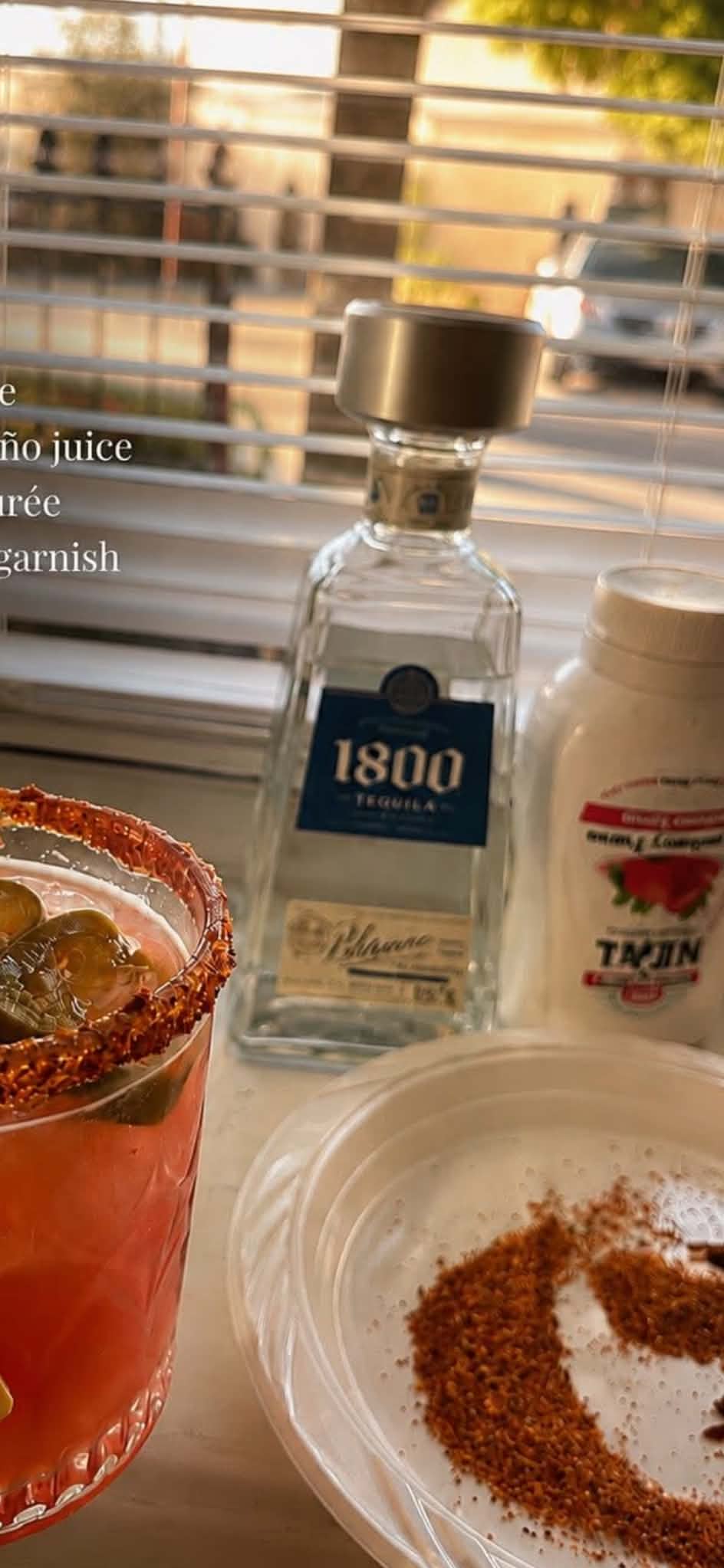 A spicy jalapeño margarita with a Tajín rim